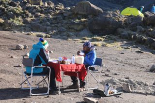 Each pause carries a story of trust and endurance. Up here, where the air is scarce and the world feels distant, even a modest meal feels deserved. Between earth and sky, strength is gently restored.

🎥Join us for an authentic Tanzanian experience, where every adventure tells a story.

📞 Contact & Bookings:

🌍 Website: www.rockyafricaexperience.com
📧 Email: info@rockyafricaexperience.com
📱 Phone/WhatsApp: +255 713550312

Follow us for more stories and adventure inspirations!
 
#RockyAfricaExperience
#ClimbKilimanjaro
#RoofOfAfrica
#KilimanjaroExperience
#TanzaniaAdventure
#ExploreTanzania
#HikingAfrica
#SummitViews
#TravelAfrica
#2026Adventures