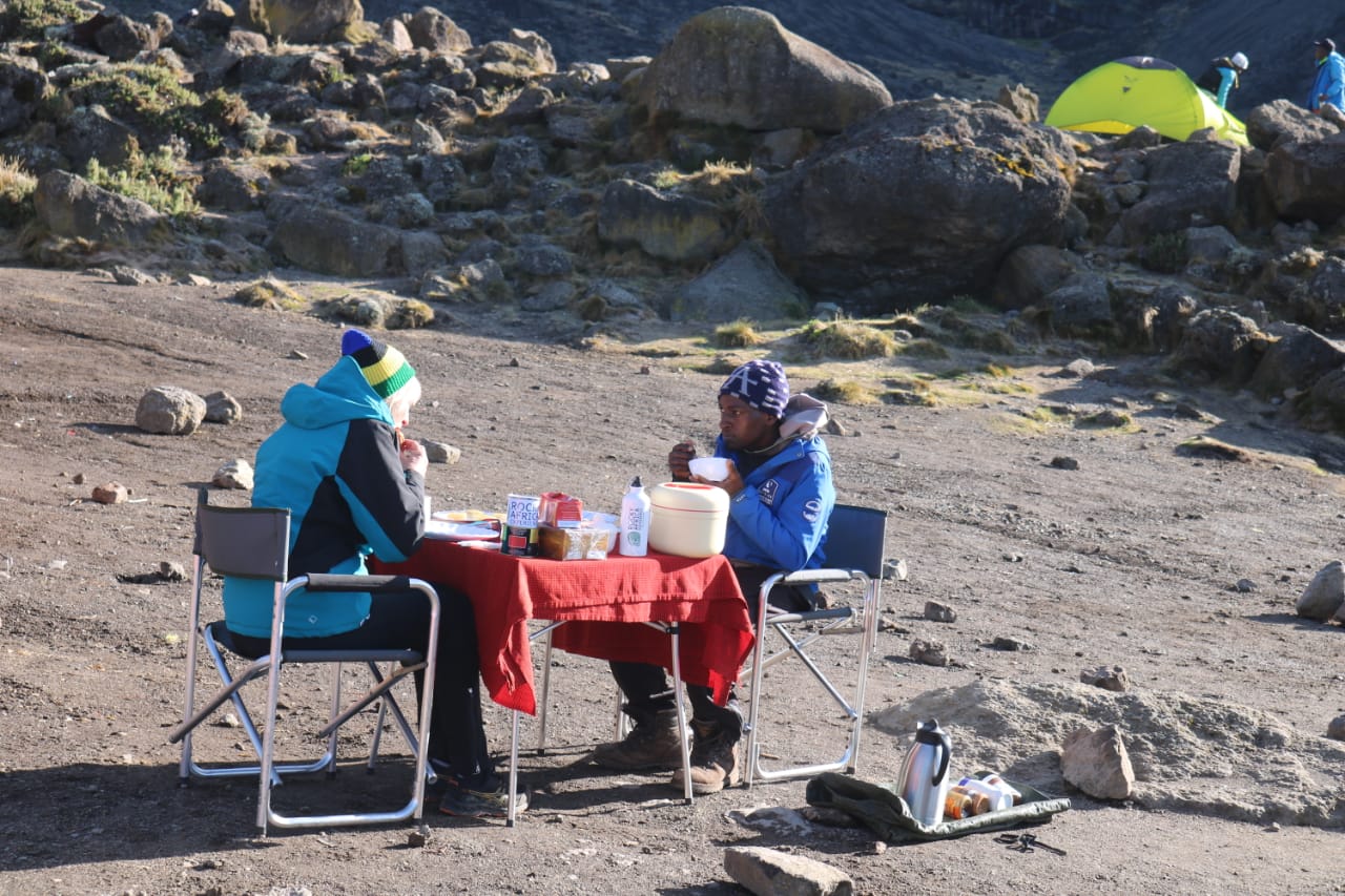 Each pause carries a story of trust and endurance. Up here, where the air is scarce and the world feels distant, even a modest meal feels deserved. Between earth and sky, strength is gently restored.

🎥Join us for an authentic Tanzanian experience, where every adventure tells a story.

📞 Contact & Bookings:

🌍 Website: www.rockyafricaexperience.com
📧 Email: info@rockyafricaexperience.com
📱 Phone/WhatsApp: +255 713550312

Follow us for more stories and adventure inspirations!
 
#RockyAfricaExperience
#ClimbKilimanjaro
#RoofOfAfrica
#KilimanjaroExperience
#TanzaniaAdventure
#ExploreTanzania
#HikingAfrica
#SummitViews
#TravelAfrica
#2026Adventures